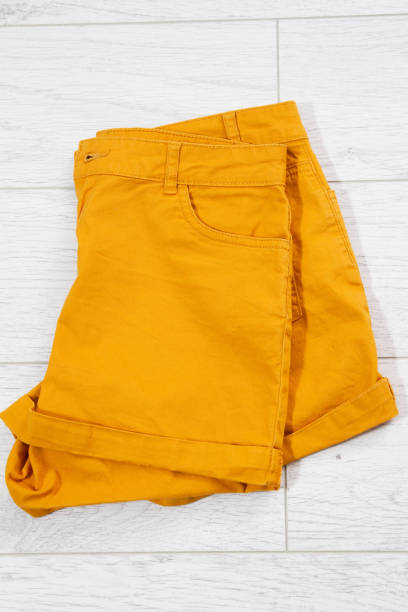 istock folded shorts close up top view on wooden background 1309969960