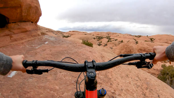 first person perspective as mountain biker follows desert pathway - 3498 imagens e fotografias de stock