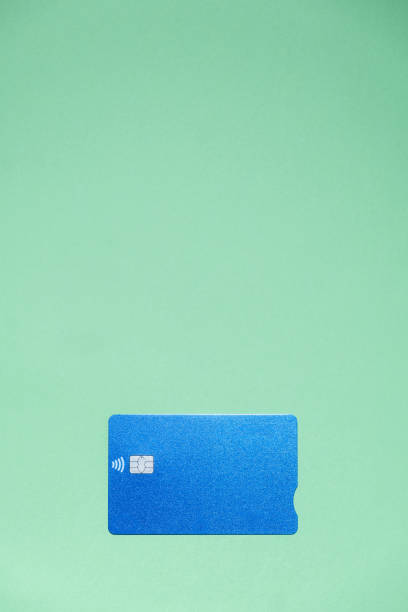 istock A blue credit card on a light green background with a large copy space 1309970400