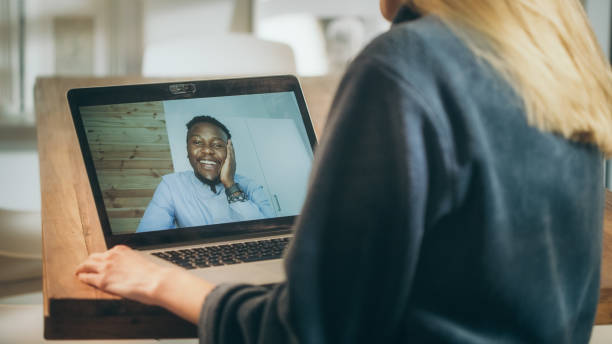 istock Missing a boyfriend during lockdown. Woman doing video call with African ethnicity an 1309971192