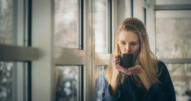 istock Morning coffee with winter view 1309971229