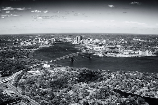 Aerial view of the beautiful city of Jacksonville Florida along the St. Johns River from an altitude of about 1000 in black and white.