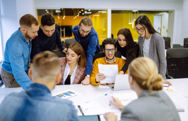 istock Group of young businesspeople working together in creative office. 1309972967