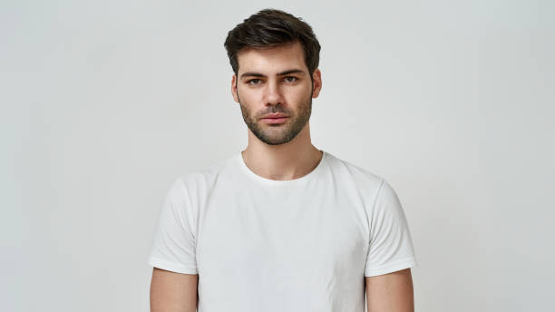 istock Handsome man with beard wearing casual t-shirt 1309973220