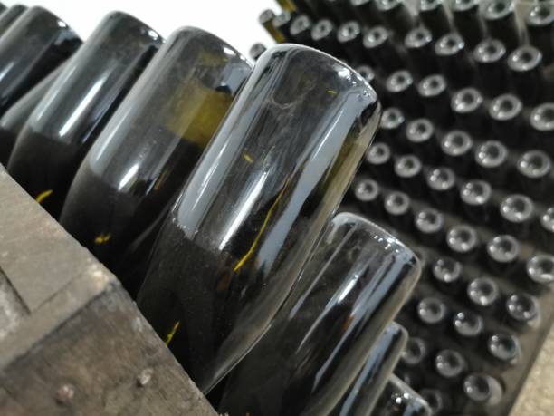 istock Champagne bottle production in winery cellar 1309974171