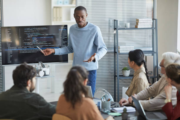 istock African Man Presenting in IT Meeting 1309975838