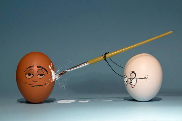 istock Two chicken eggs white and brown are preparing for the Easter holiday, and paint each other 1309976874