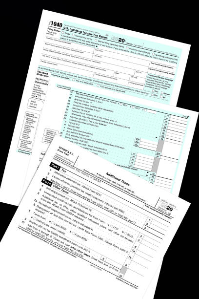 istock 2020 IRS tax forms lay on a black desktop. 1309976890