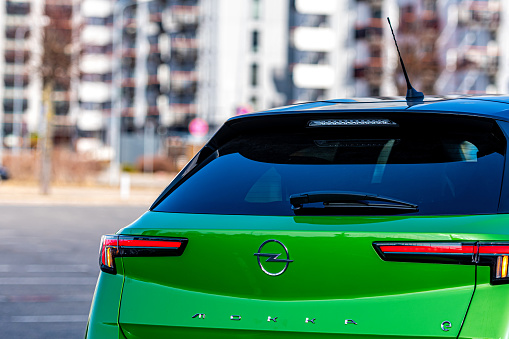 Riga, Latvia - 26 March, 2021: close-up of the green electric vehicle Opel Mokka-e, future technologies, modern design