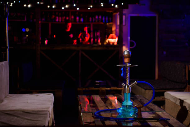 istock Hookah on the background of a bar, light, smoke, smog 1309979227
