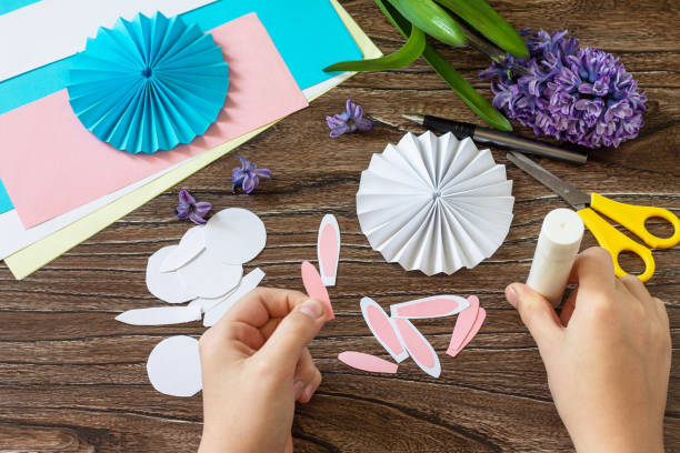 istock Instruction step 6. Children's paper decor. Funny paper easter bunny. Easter handmade Project of children's creativity, handicrafts, crafts for kids. 1309980345