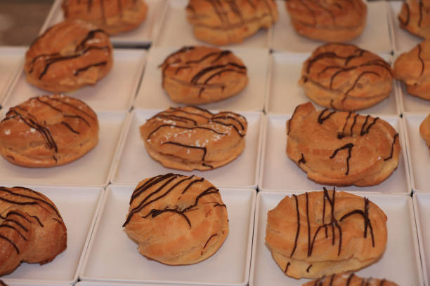 istock Profiteroles decorated with chocolate 1309980860