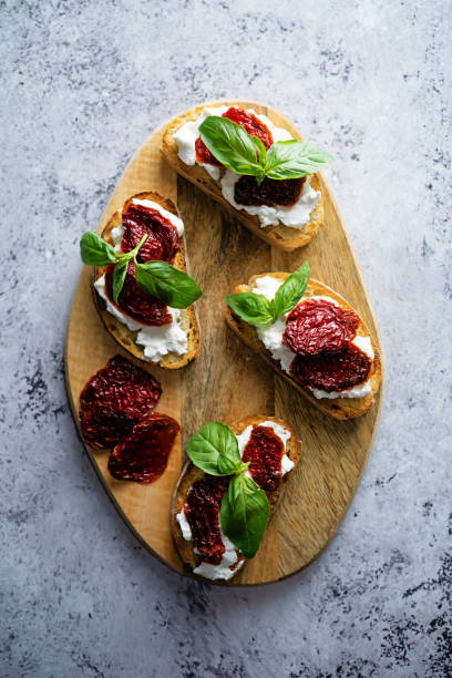 istock Ricotta dried tomato Basil bruschetta 1309981758