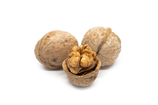 Group of whole walnuts isolated on white