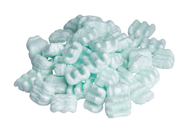 Green polystyrene foam chips isolated on a white background with clipping path. stock photo