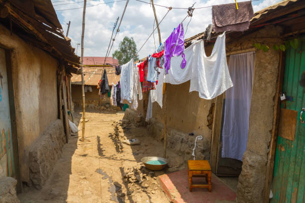 A line of clean clothes dry among the dirty mud and clay homes of the Kibera slum in Nairobi.