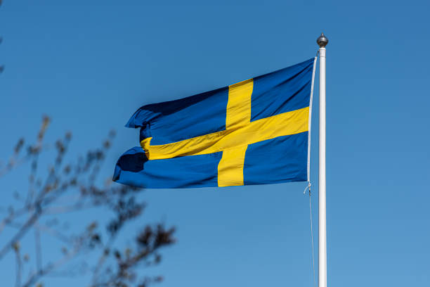 istock Swedish flag on a flag pole.. 1309986517