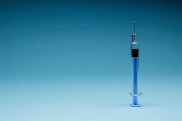istock syringe with medical supplies 1309988530