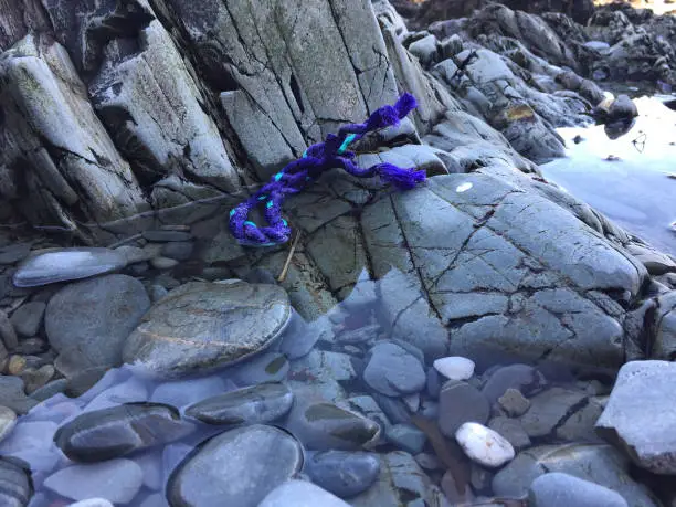 Photo of Fishing rope debris on Onchan Harbour beach at low tide - Onchan, Isle of Man