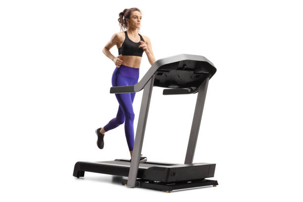 giovane donna che corre su una macchina per tapis roulant - treadmill exercise machine isolated exercising foto e immagini stock