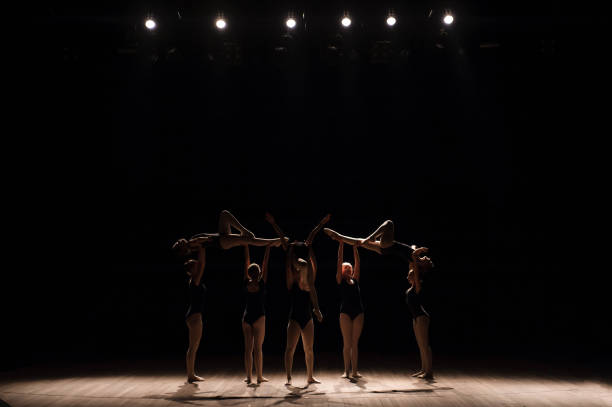 istock Acrobatic dance. Dance with elements of acrobatics. Girls doing dance support. 1309991009