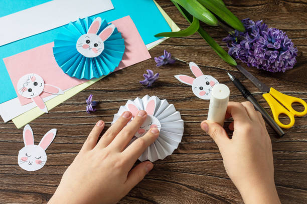 istock Instruction step 9. Children's paper decor. Funny paper easter bunny. Easter handmade Project of children's creativity, handicrafts, crafts for kids. 1309991257