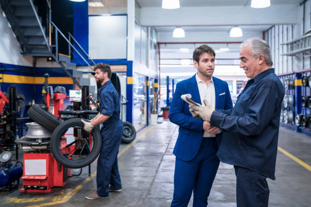 istock Car mechanic talking with customer 1309992279