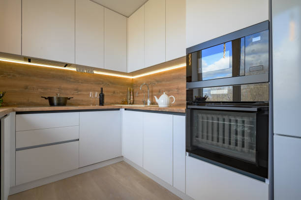 istock Modern white and beige wooden kitchen interior 1309994027