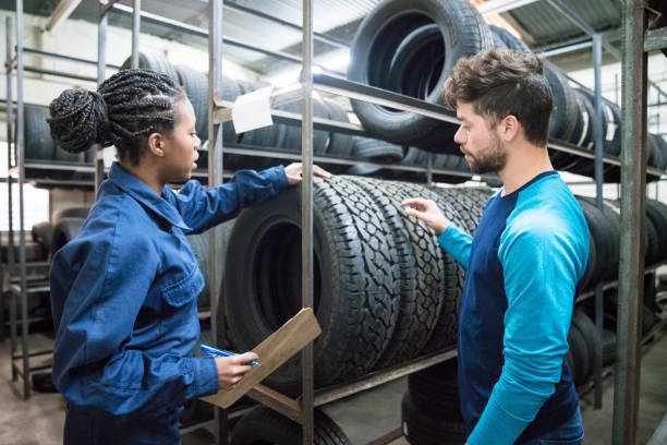 istock Customer choosing car tire in automobile store 1309994185