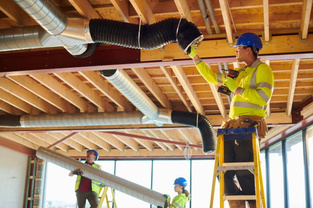 air conditioning duct install air conditioning duct install heating engineer stock pictures, royalty-free photos & images