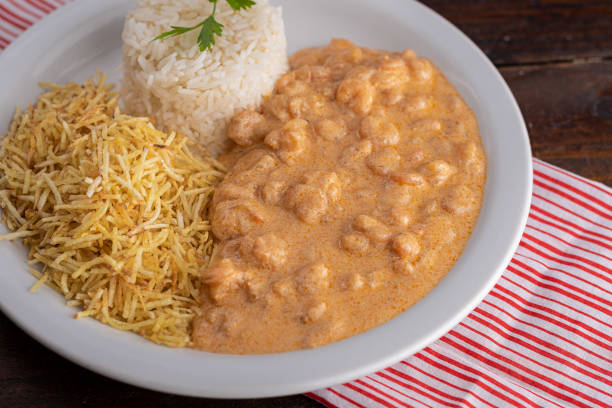 istock Meals - Done Dish - Shrimp stroganoff with straw potatoes and rice 1309995664