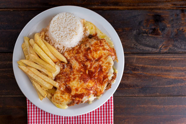 食事 - 完了料理 - ライス、フライドポテト、チキンパルミジャーナ - schnitzel cutlet meal french fries ストックフォトと画像