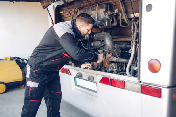 istock Male mechanic working on a bus motor 1310002553