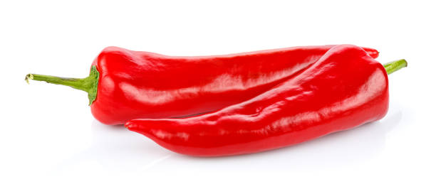 istock Two red hot chili peppers isolated on white background 1310002580