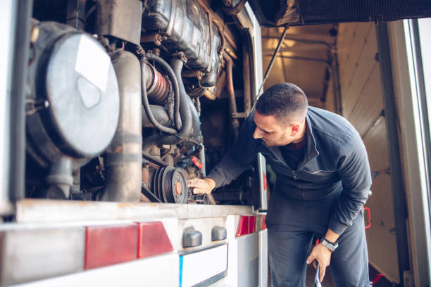 istock Male mechanic working on a bus motor 1310002618