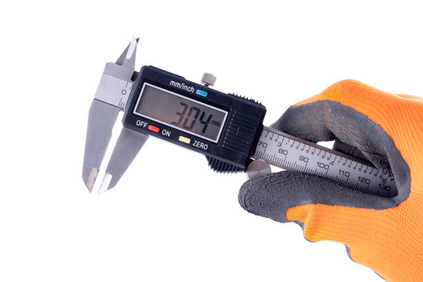 istock A caliper for mechanical measurements in the hand. Accessories for precision measuring in a gloved hand. Light background. 1310004306