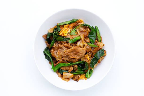 istock Stir fried flat noodle and pork with soy sauce. 1310004327