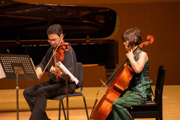 istock Musicians playing violin and cello at classical music concert 1310006912