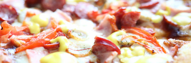 Fresh baked pizza with crusty cheese and hot tasty pepperoni ready to eat