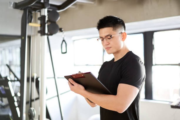 istock Asian male trainer hearing at a training gym 1310011702