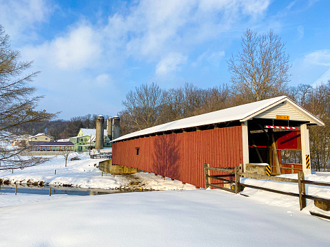 Jackson's Saw Mill Covered Bridge surrounded by snow in Lancaster County Pennsylvania