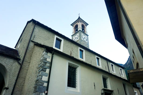 church and bell tower of santi luca e abbondio, avegno, switzerland - switzerland ticino canton valley church imagens e fotografias de stock