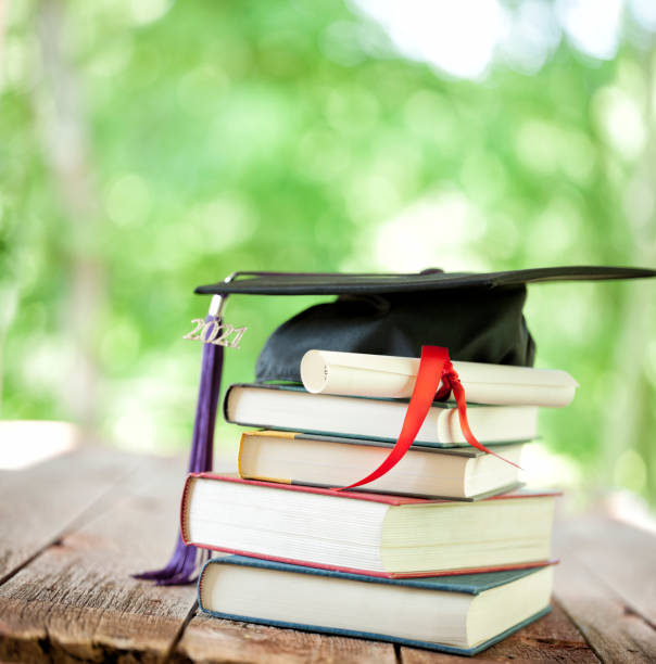 istock Graduation 2021 Cap & Diploma against a Natural Background 1310021554