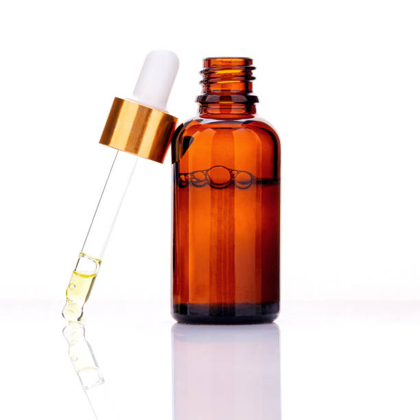 istock Essential oil bottles with dropper and bubble isolated on white background. 1310023228