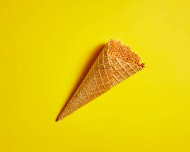 istock Ice cream cones on yellow background 1310025693