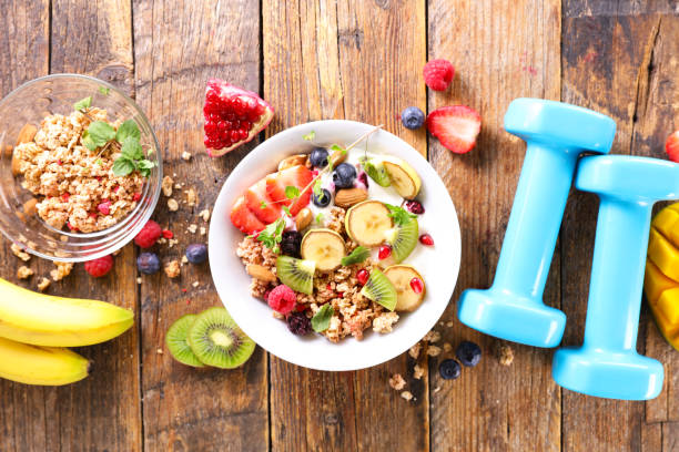 istock diet food concept- oatmeal and dumbbell 1310027983