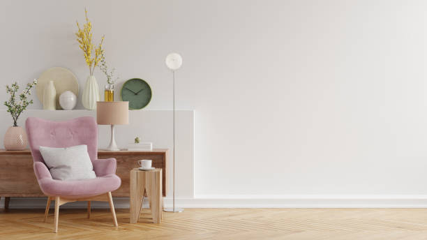 istock Modern minimalist interior with an armchair on empty white wall background. 1310028756