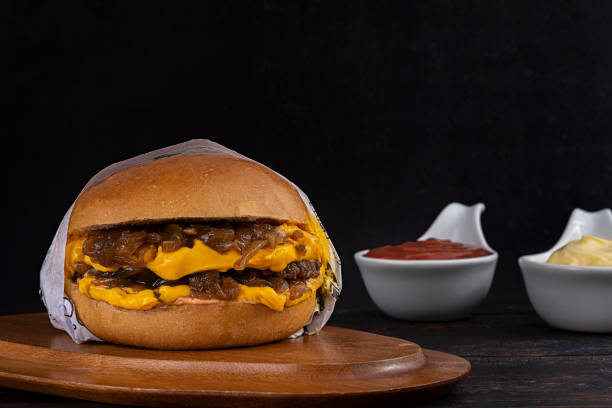 istock hamburger with beef, cheddar cheese and caramelized onion 1310029378
