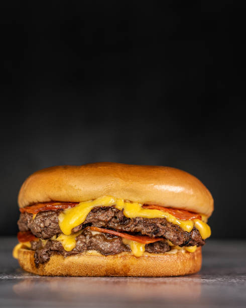 istock smash burger with two burgers, cheese sauce and pepperoni 1310029422