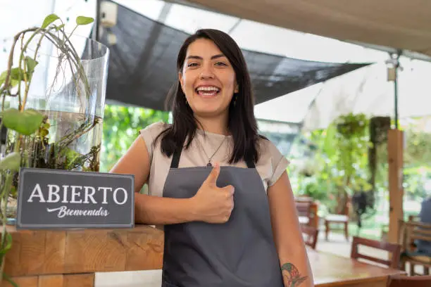 Photo of Woman cafeteria employee placing 